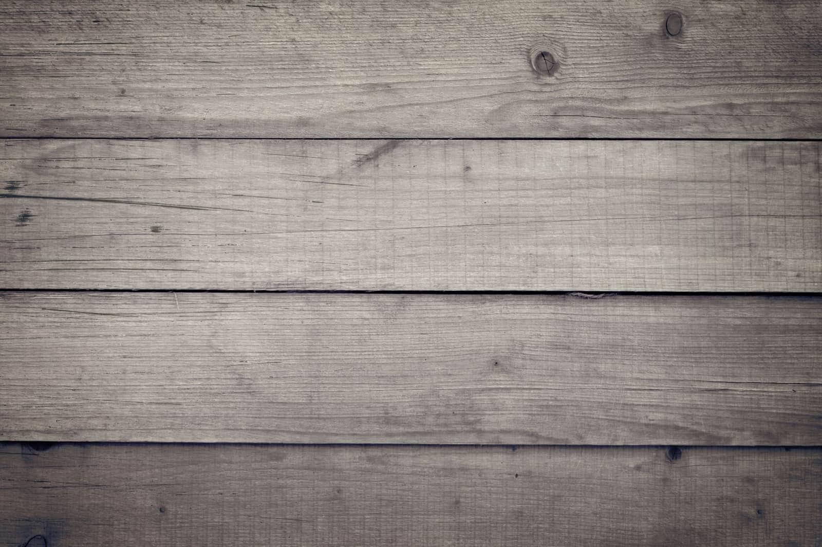 A rustic wooden plank texture ideal for backgrounds and design projects.